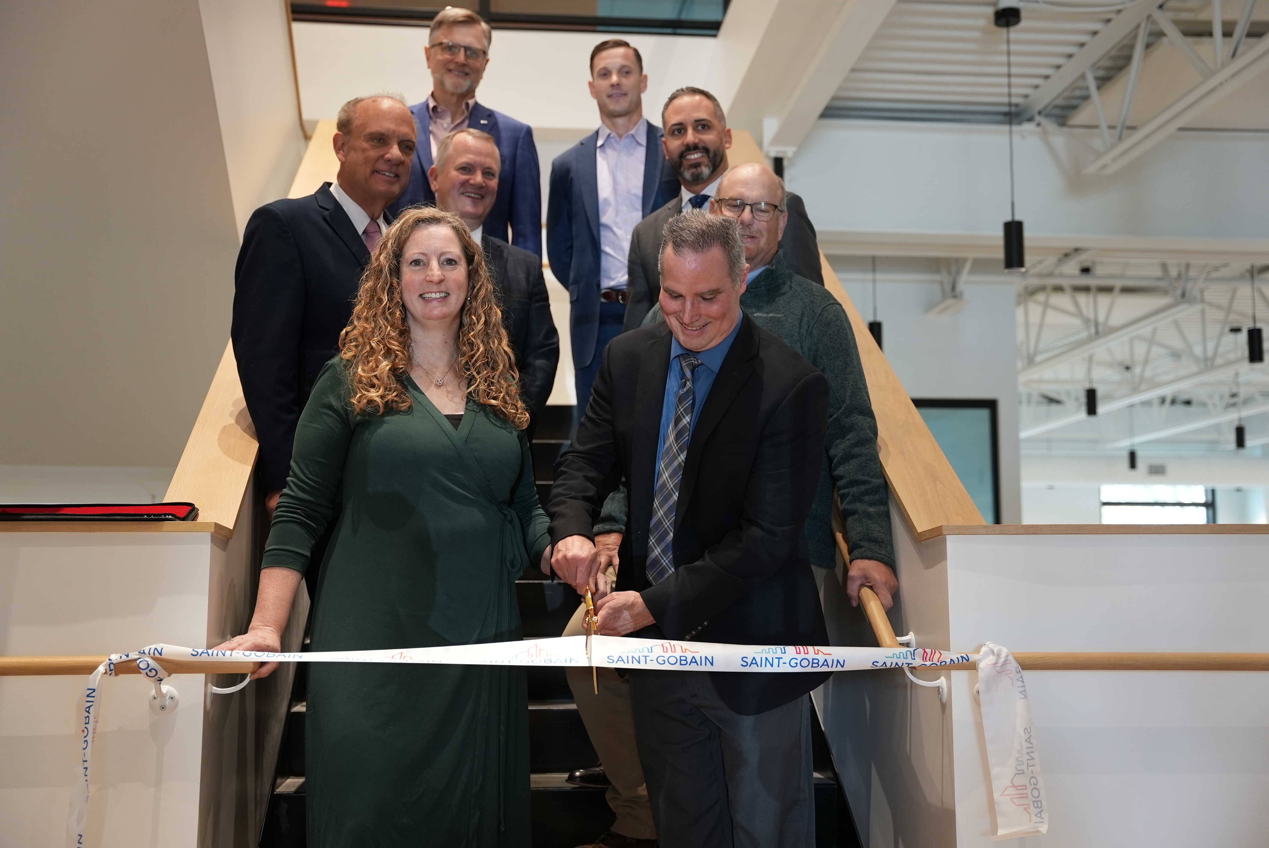 /group%20of%20people%20cutting%20a%20ribbon