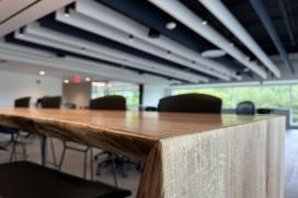 Salvaged wood is used for a countertop in the cafe area in the office.