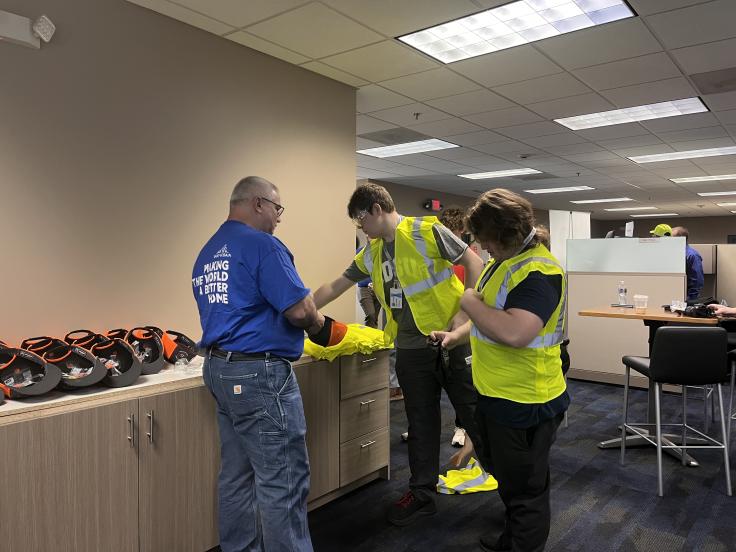 Students putting on their safety gear in preparation for SFRC, a workforce development program