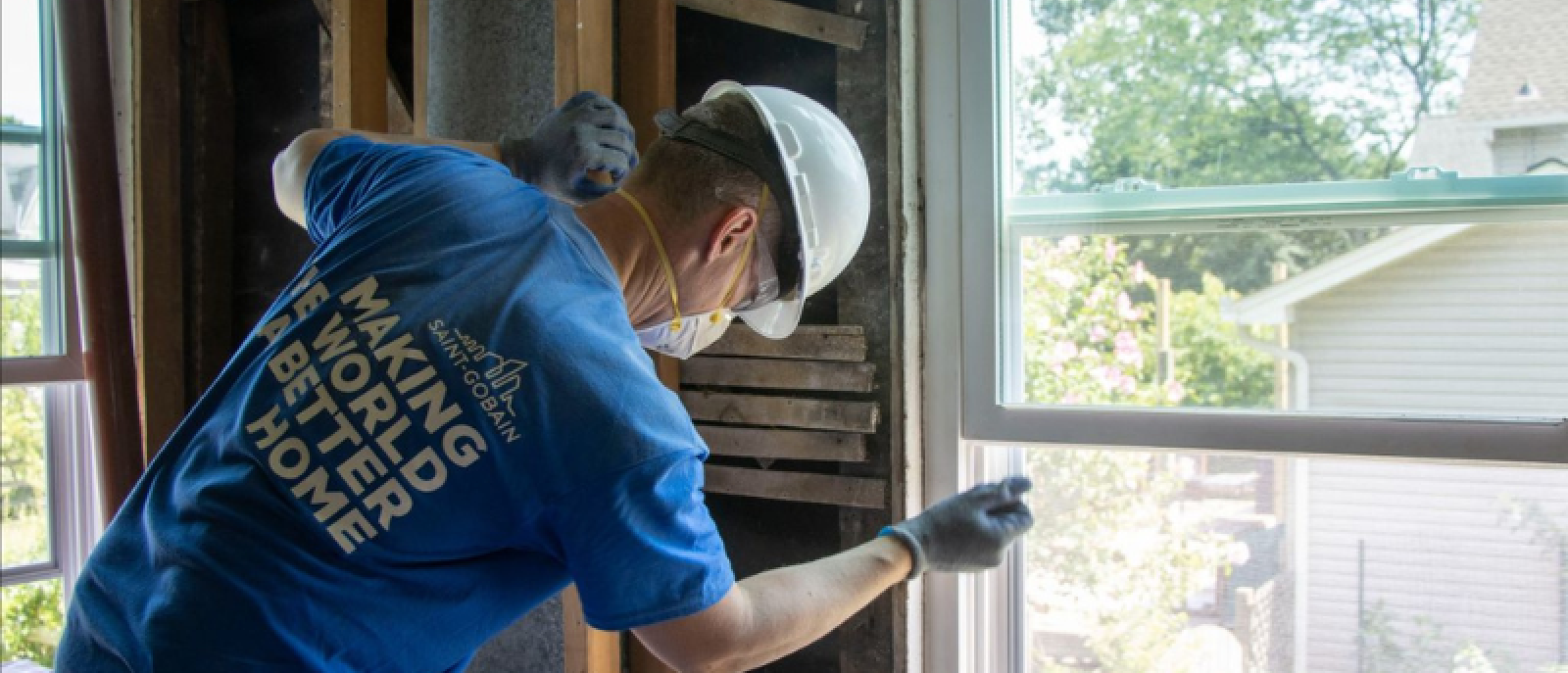 A construction worker actively engaged on-site, representing sustainability efforts in the construction industry.